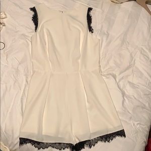 Aqua white romper with black lace trim